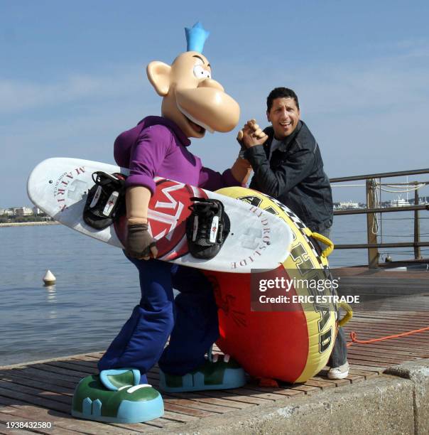 French humorist Smaïn poses with comic's character Franky Snow, 16 April 2007 in the French southern city of Cannes, during the 44th edition of the...