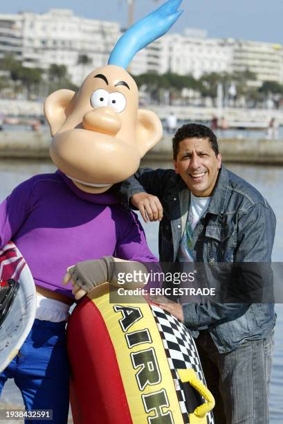 French humorist Smaïn poses with comic's character Franky Snow, 16 April 2007 in the French southern city of Cannes, during the 44th edition of the...