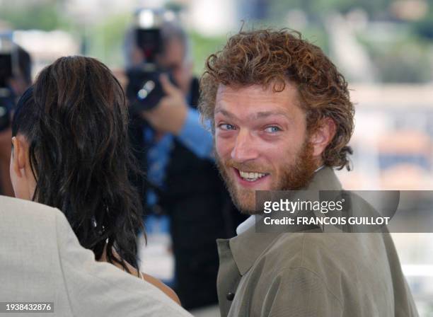 French actor Vincent Cassel poses for photographers next to Italian actress Monica Bellucci during a photocall for the film 'Irreversible' by...