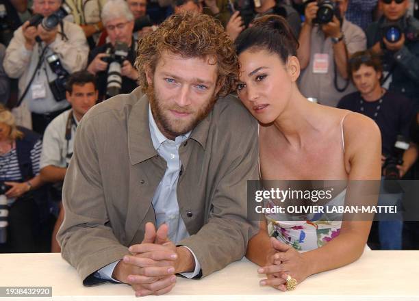 Italian actress Monica Bellucci and French actor Vincent Cassel pose together for photographers during a photocall for the film 'Irreversible' by...