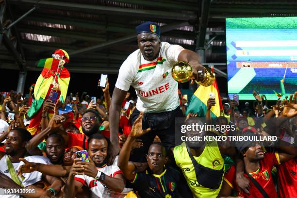 Guinea supporters cheers during the Africa Cup of Nations 2024 group C football match between Guinea and Gambia at the Stade Charles Konan Banny in...
