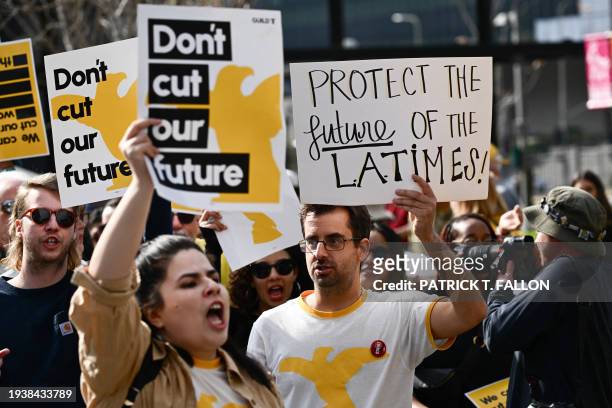 Times Guild journalists rally in front of City Hall to protest against layoffs and changes to job seniority protections during a walkout of the Los...
