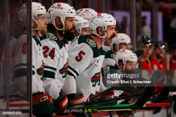 The Minnesota Wild cheer on their teammates on the ice against the Florida Panthers at the Amerant Bank Arena on January 17, 2024 in Sunrise, Florida.