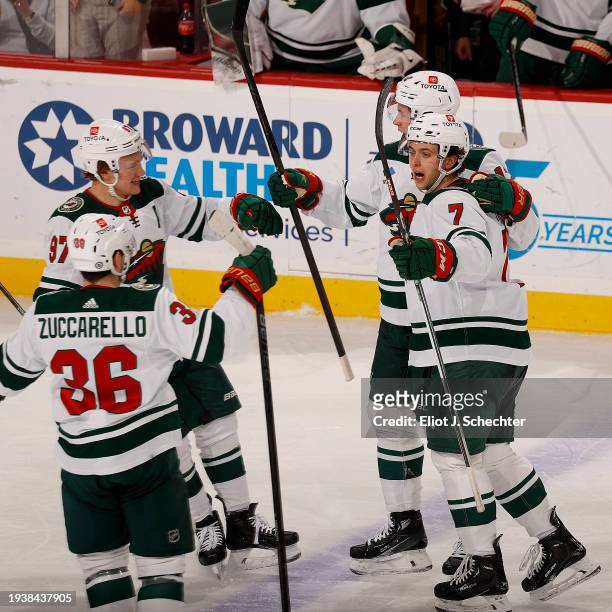 Joel Ericsson Ek of the Minnesota Wild celebrates his goal with teammates during the second period against the Florida Panthers at the Amerant Bank...