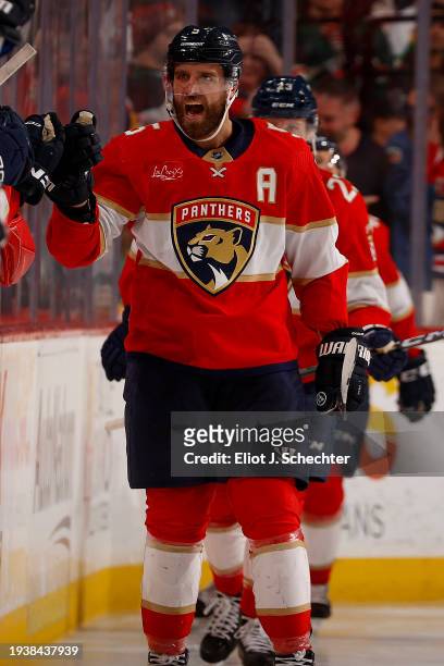 Aaron Ekblad of the Florida Panthers celebrates his goal with teammates during the seance period against the Minnesota Wild at the Amerant Bank Arena...