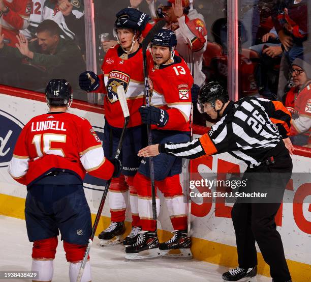 Eetu Luostarinen of the Florida Panthers celebrates his goal with teammates Sam Reinhart and Anton Lundell during the second period against the...