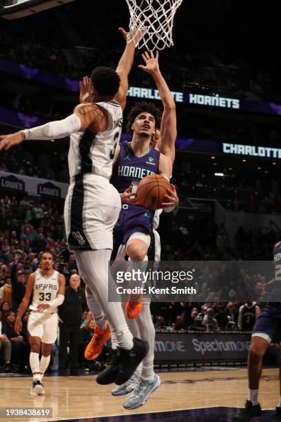 LaMelo Ball of the Charlotte Hornets drives to the basket during the game against the San Antonio Spurs on January 19, 2024 at Spectrum Center in...