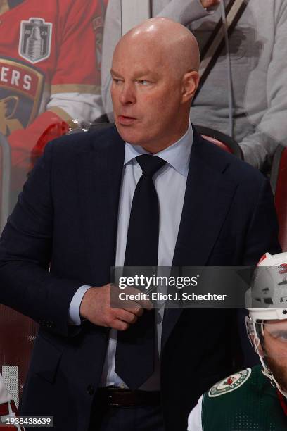 Minnesota Wild Head Coach John Hynes monitors game progress from the bench against the Florida Panthers at the Amerant Bank Arena on January 17, 2024...