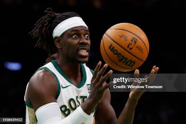 Jrue Holiday of the Boston Celtics reacts to having a double dribble called on him during the second half against the Denver Nuggets at TD Garden on...