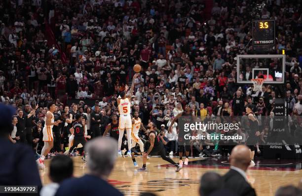Dejounte Murray of the Atlanta Hawks scores the game winning three point basket during the game against the Miami Heat on January 19, 2024 at Kaseya...