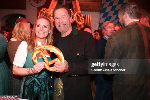 Heather Milligan, Arnold Schwarzenegger during the 31st Weißwurstparty at Hotel Stanglwirt on January 19, 2024 in Going near Kitzbuehel, Austria.