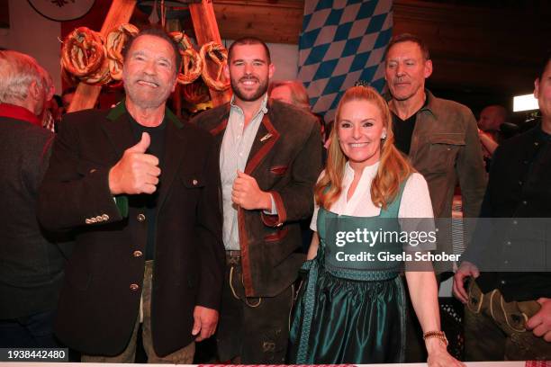 Arnold Schwarzenegger his son Christopher Schwarzenegger and Heather Milligan during the 31st Weißwurstparty at Hotel Stanglwirt on January 19, 2024...