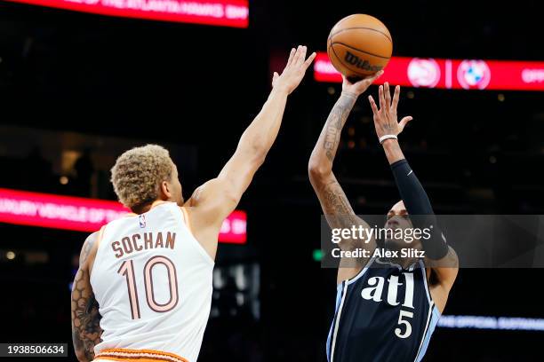 Dejounte Murray of the Atlanta Hawks shoots over Jeremy Sochan of the San Antonio Spurs during the first half at State Farm Arena on January 15, 2024...