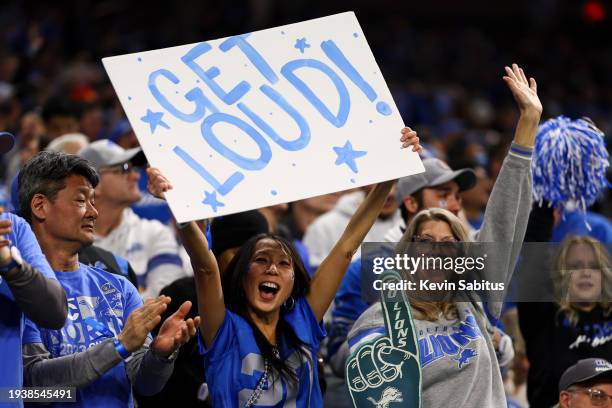 Detroit Lions fan holds a sign reading “Get Loud!” during an NFL wild-card playoff football game against the Los Angeles Rams at Ford Field on...