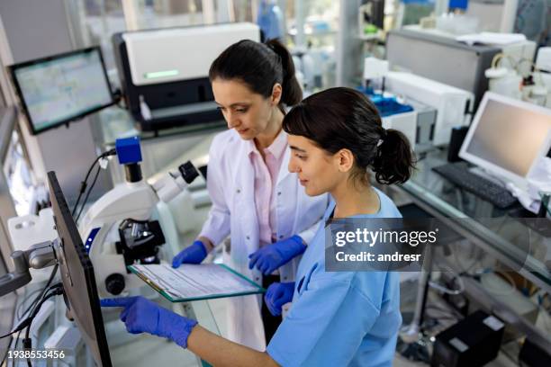 team of medical researchers working at the laboratory - microbiologist stock pictures, royalty-free photos & images