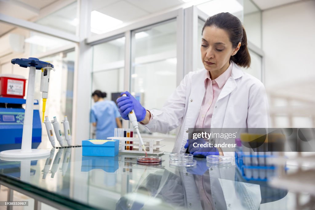 Doctor working at a laboratory analyzing blood samples