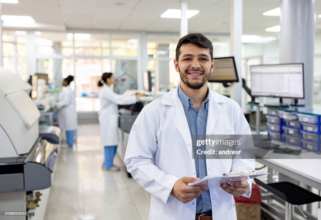 Doctor working at a laboratory and holding test results