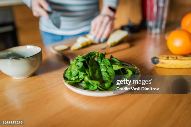 pregnant woman making healthy smoothie. healthy eating concept. - spinach stock pictures, royalty-free photos & images