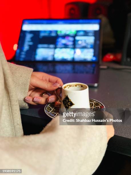 girl drinking coffee while working - yemen people stock pictures, royalty-free photos & images