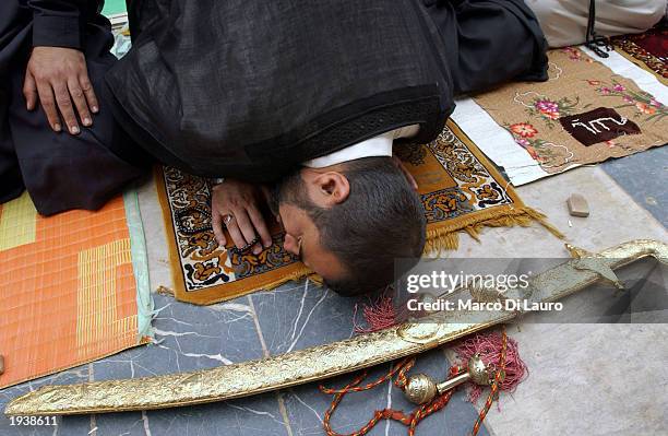 Muslim Shia prays during Friday prayers at the Kadhimain Mosque April18, 2003 in Baghdad, Iraq. Most of Iraqi Muslims are either Sunnis or Shias,...