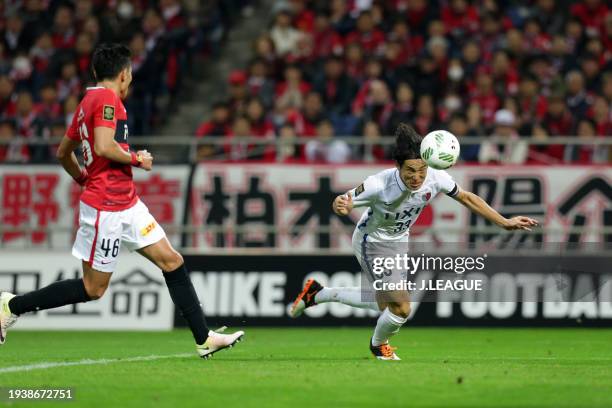 Mu Kanazaki of Kashima Antlers heads to score the team's first goal during the J.League Championship Final second leg match between Urawa Red...