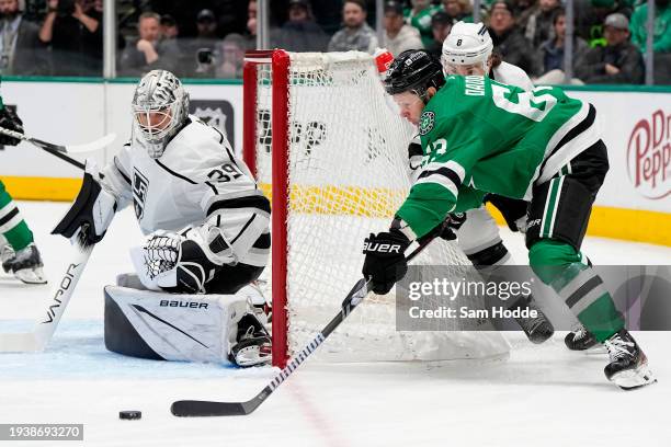 Evgenii Dadonov of the Dallas Stars skates with the puck around the net as Cam Talbot of the Los Angeles Kings defends during the first period at...