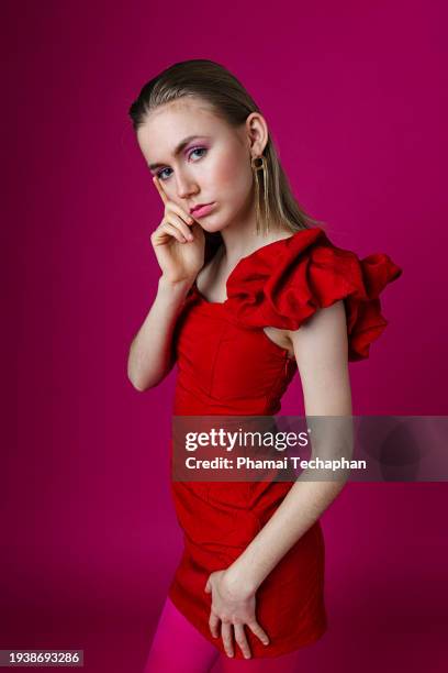 fashionable woman on plain background - form fitted dress stock pictures, royalty-free photos & images