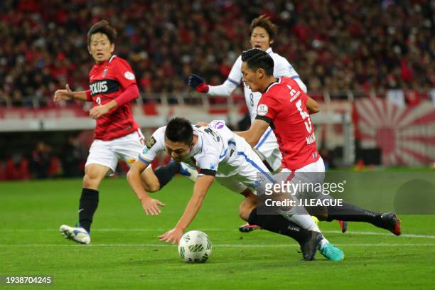 Yuma Suzuki of Kashima Antlers is brought down by Tomoaki Makino of Urawa Red Diamonds in the penalty box resulting in a penalty awarded to Kashima...