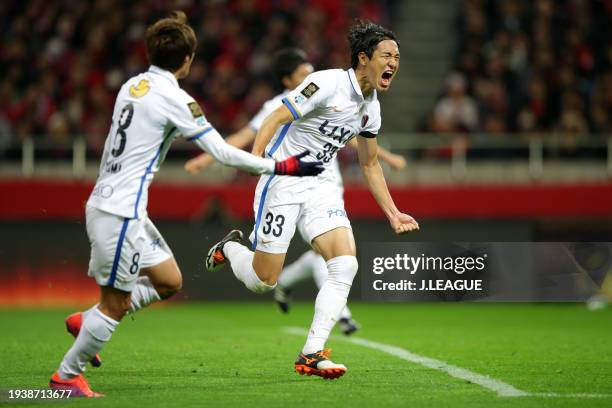 Mu Kanazaki of Kashima Antlers celebrates with teammate Shoma Doi after scoring the team's second goal during the J.League Championship Final second...