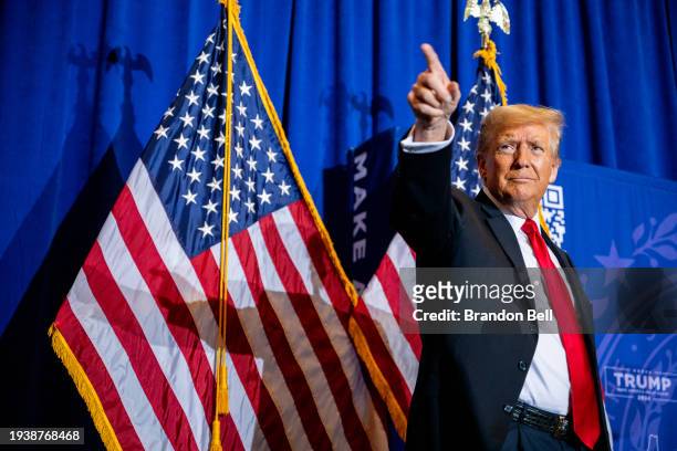 Republican presidential candidate, former U.S. President Donald Trump points to supporters at the conclusion of a campaign rally at the Atkinson...