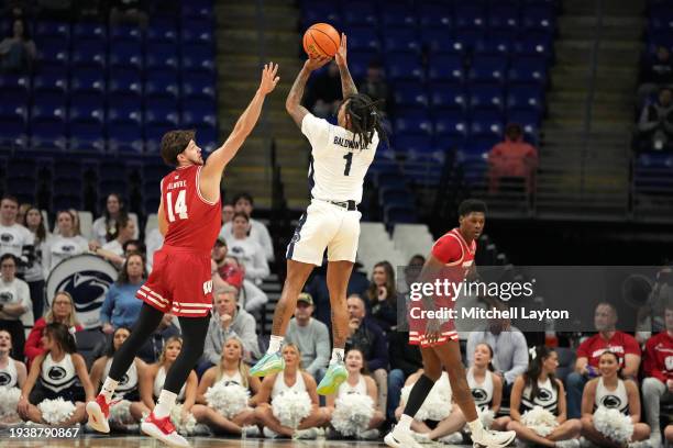 Ace Baldwin Jr. #1 of the Penn State Nittany Lions takes a shot over Carter Gilmore of the Wisconsin Badgers in the first half during a college...