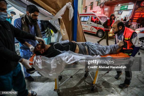 Palestinian injured in Israeli air strikes arrives at Kuwait Hospital for treatment on January 17, 2024 in Rafah, Gaza. Israel increased air raids in...