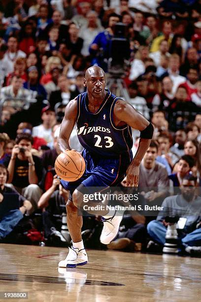 Michael Jordan of the Washington Wizards drives the ball upcourt against the Philadelphia 76ers during the final NBA game of his career, played at...