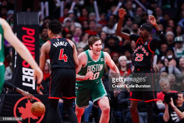 Luke Kornet of the Boston Celtics reacts after he dunks against the Toronto Raptors during the second half of their NBA game at Scotiabank Arena on...