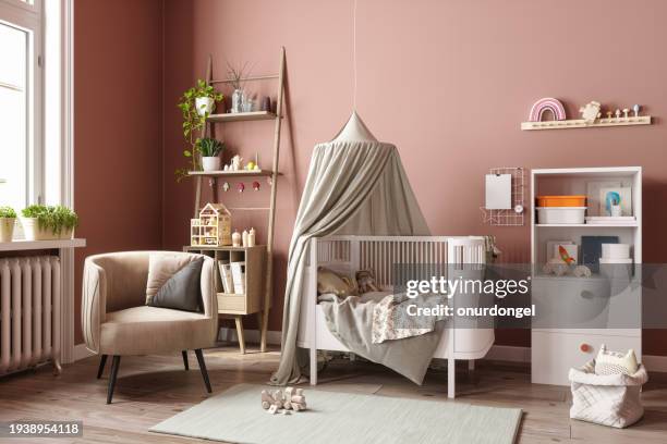 modern baby room interior with messy crib, cabinet, armchair, toys and plants - nursery bedroom stock pictures, royalty-free photos & images