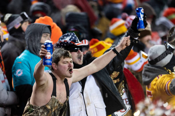 Fans cheer with Bud Light during an NFL wild-card playoff football game between the Miami Dolphins and Kansas City Chiefs at GEHA Field at Arrowhead...