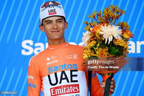 Isaac Del Toro Romero of Mexico and UAE Team Emirates celebrates at podium as Orange Santos Leader's Jersey winner during the 24th Santos Tour Down...