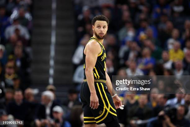 Stephen Curry of the Golden State Warriors stands on the court during their game against the New Orleans Pelicans at Chase Center on January 10, 2024...