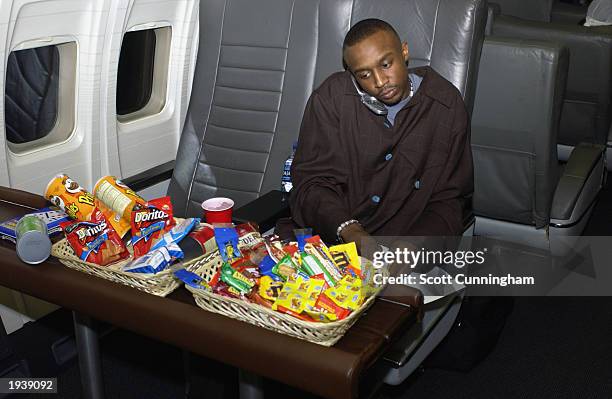 Jason Terry of the Atlanta Hawks on the team plane during a road trip to play the Chicago Bulls on March 18, 2003 in Chicago, Illinois. NOTE TO USER:...