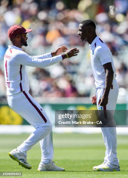 Shamar Joseph of the West Indies celebrates the wicket of Steve Smith of Australia with Kraigg Brathwaite, Captain of the West Indies during day one...