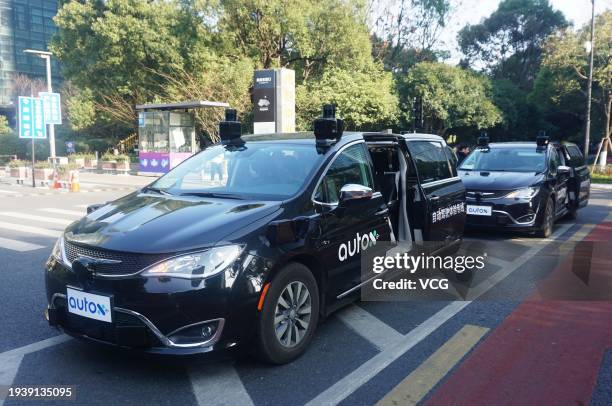 Self-driving taxi equipped with driverless devices runs on a street on January 16, 2024 in Hangzhou, Zhejiang Province of China. Hangzhou launched...