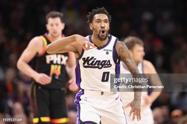 Malik Monk of the Sacramento Kings reacts to a three-point shot against the Phoenix Suns during the second half of the NBA game at Footprint Center...