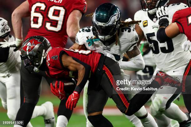 Bradley Roby of the Philadelphia Eagles tackles Deven Thompkins of the Tampa Bay Buccaneers during an NFL wild-card playoff football game at Raymond...