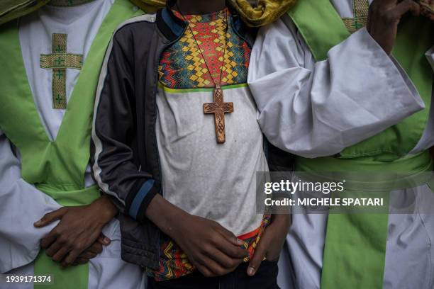 Ethiopian Orthodox priests gather at the Fasilides Bath during the celebration of Timkat, the Ethiopian Orthodox Epiphany, in Gondar on January 20,...