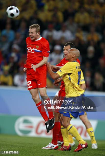June 18: Aleksandr Anyukov of Russia and Henrik Larsson of Sweden challenge during the UEFA Euro 2008 Group D match between Russia and Sweden at...