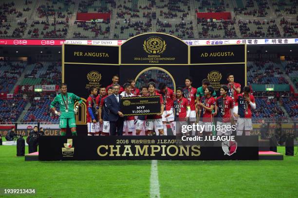 Mu Kanazaki of Kashima Antlers is awarded the MVP at the award ceremony following the J.League Championship Final second leg match between Urawa Red...