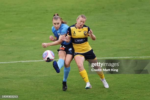 Taylor Ray of Sydney FC is challenged by Paige Hayward of the Mariners during the A-League Women round three match between Sydney FC and Central...