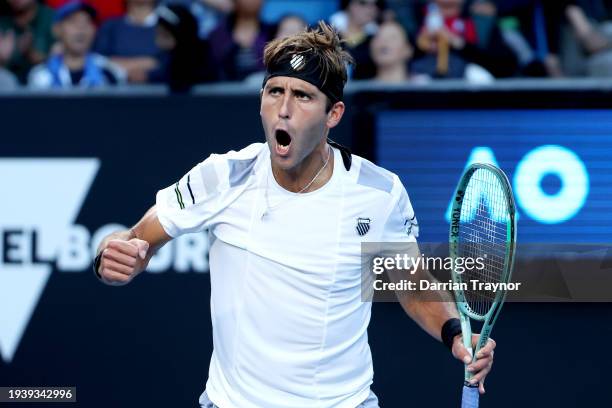 Tomas Martin Etcheverry of Argentina celebrates winning set point in their round two singles match against Gael Monfils of France during the 2024...