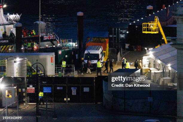 Migrants are brought ashore after being picked up in the English Channel by a Border Force vessel on January 17, 2024 in Dover, England. The first...