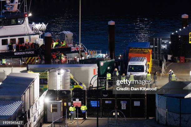 Migrants are brought ashore after being picked up in the English Channel by a Border Force vessel on January 17, 2024 in Dover, England. The first...